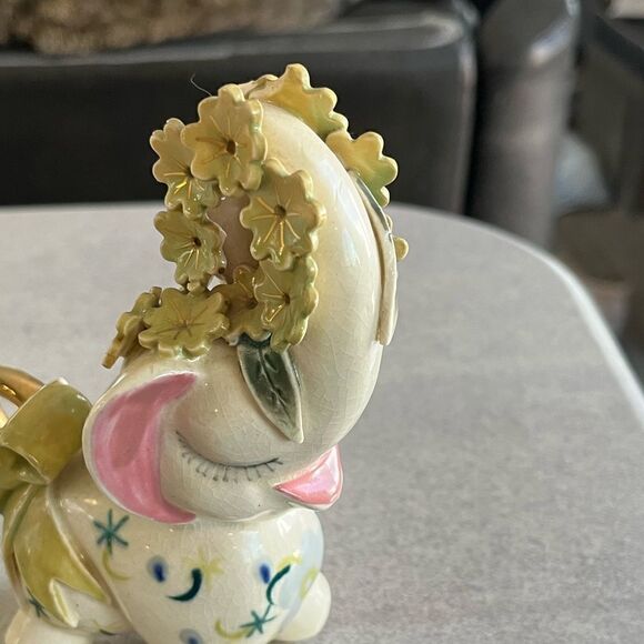 A decorated Elephant? Ceramic. Pink ears. Nose in air. Flowers on trunk. Eyelash - Picture 12 of 14